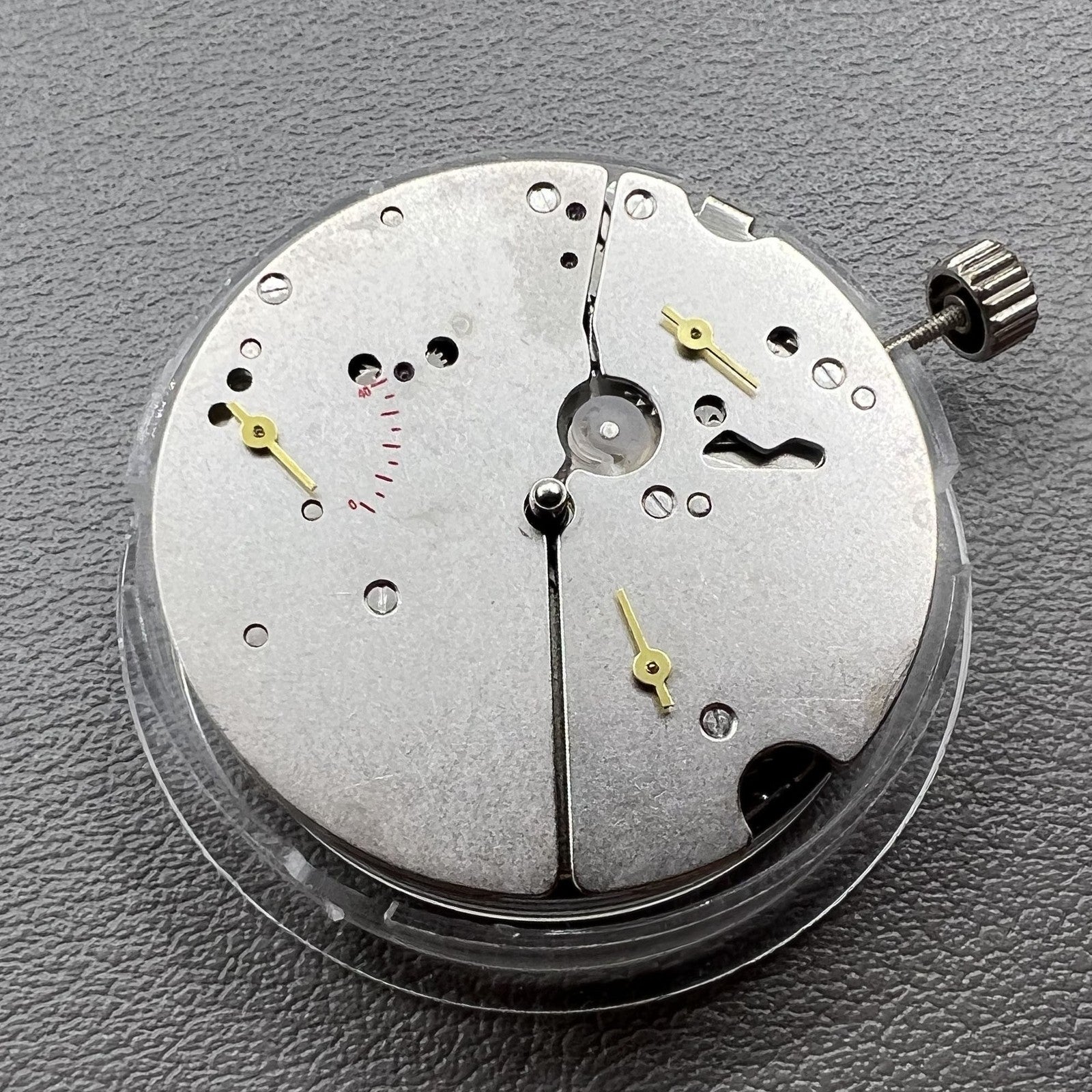 Tianjin ST17 T17 hand-wound watch movement with two hands and power reserve indicator at 10 o'clock.