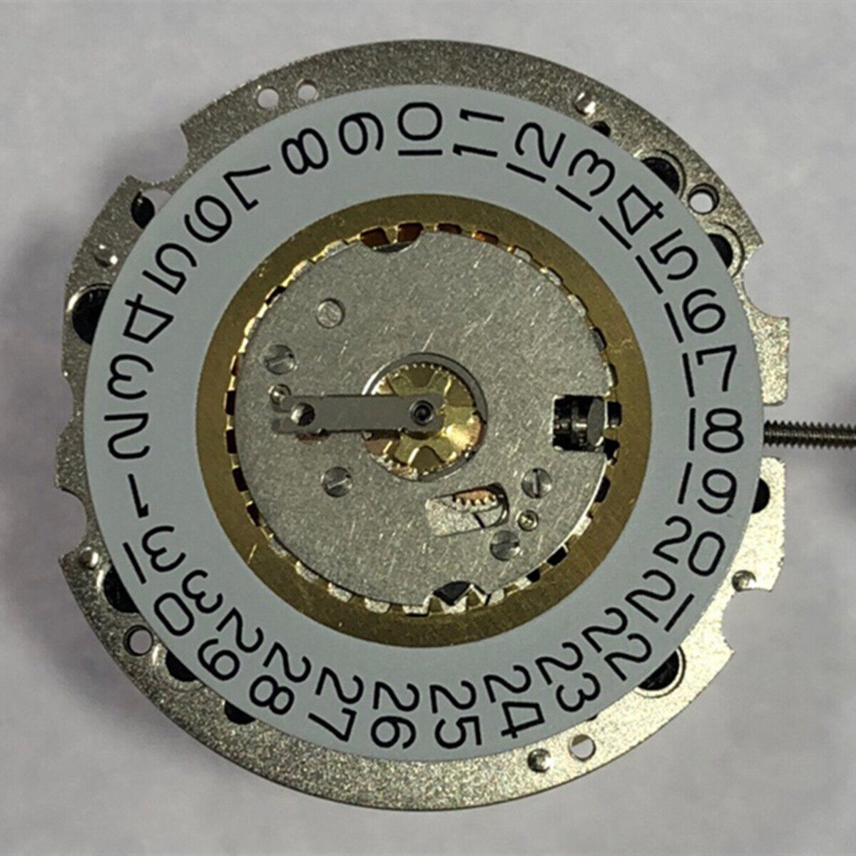 Swiss Ronda 705 quartz watch part showing 3 hands and single calendar date at 3 o'clock for precision timekeeping.
