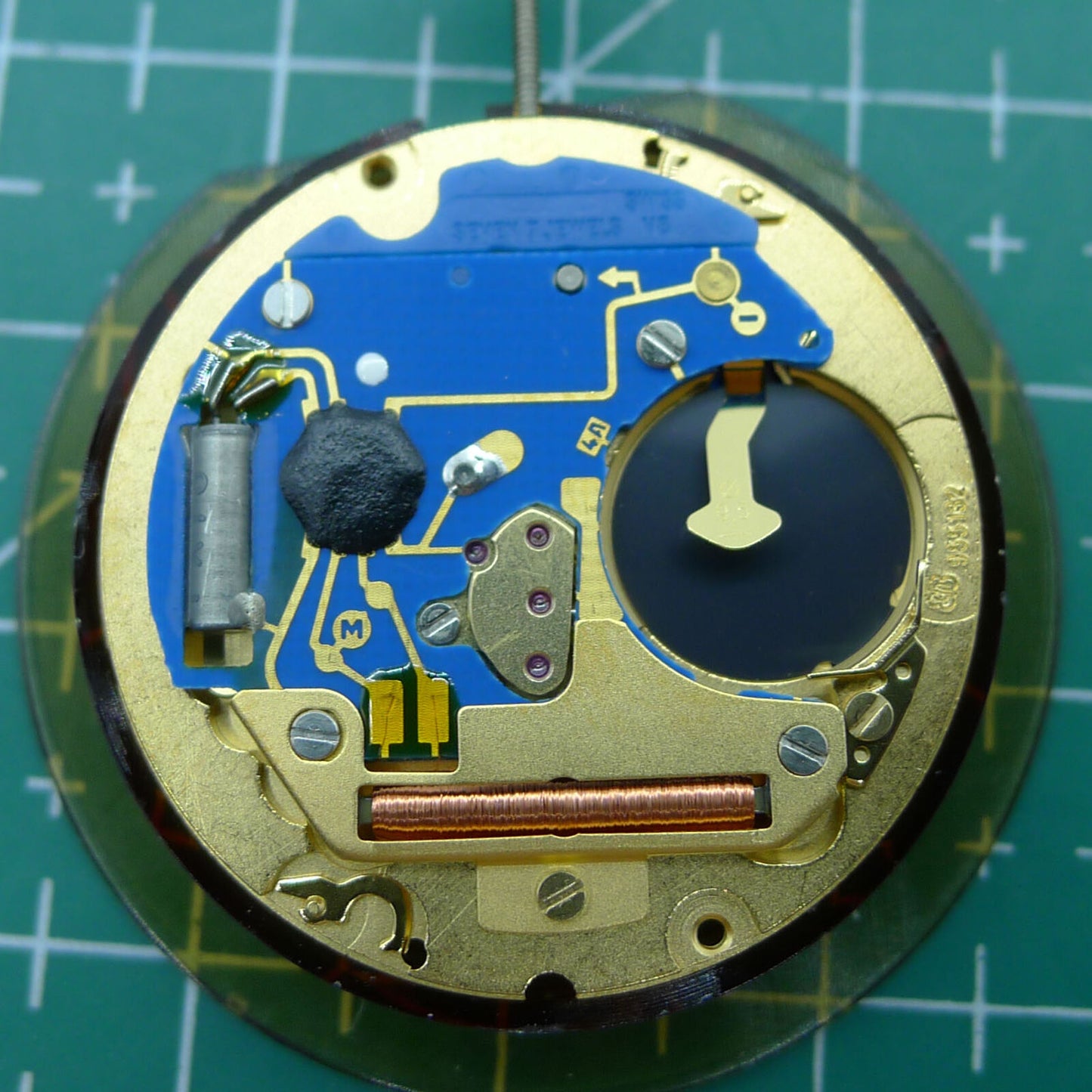 Swiss Made ETA 955.132 quartz watch movement showing double calendar with week at 12 and date at 3 features for precision timing.