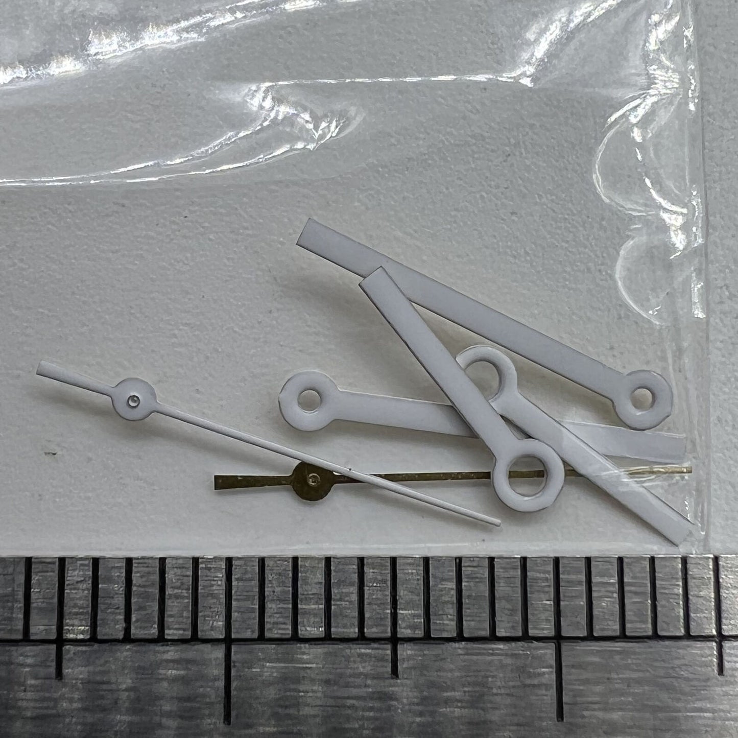 White watch hands set for Miyota 2035 series movements, precise fit for 15x13x9mm dial, brand quality.