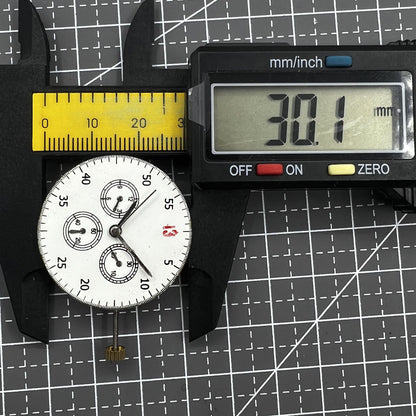 Dandong 7750 mechanical watch movement displaying small seconds at 3, 6, and 9 o?clock with no calendar.