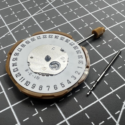 Japan Miyota GM10 watch movement with date display at 6 o'clock, precise quartz mechanism.