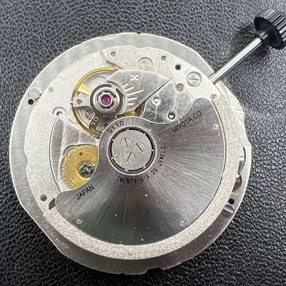 Miyota 9110 automatic watch movement featuring date display at 3 o'clock, precision mechanical design.