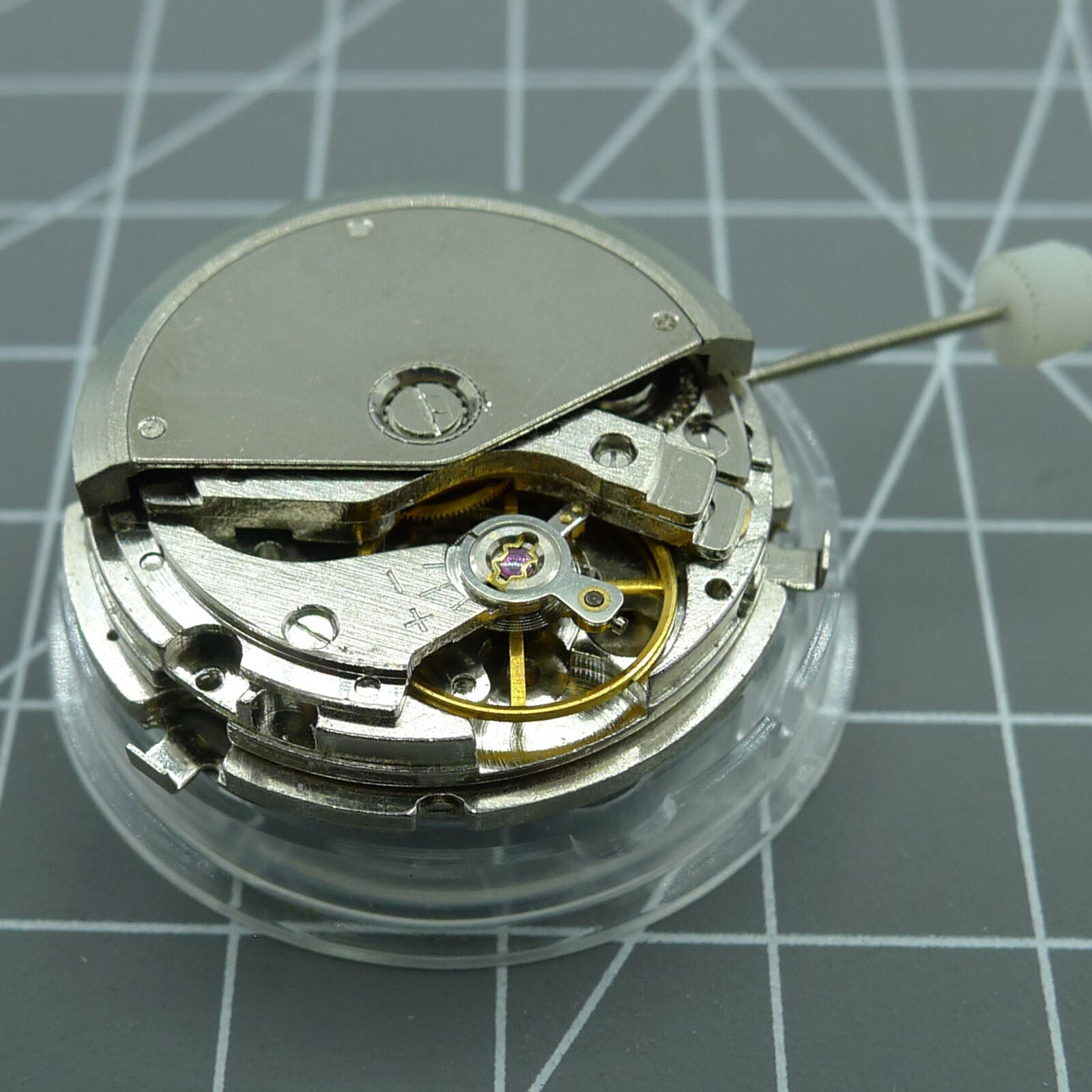 Silver automatic mechanical watch featuring week/month display at 12 o'clock and moon phase at 6.