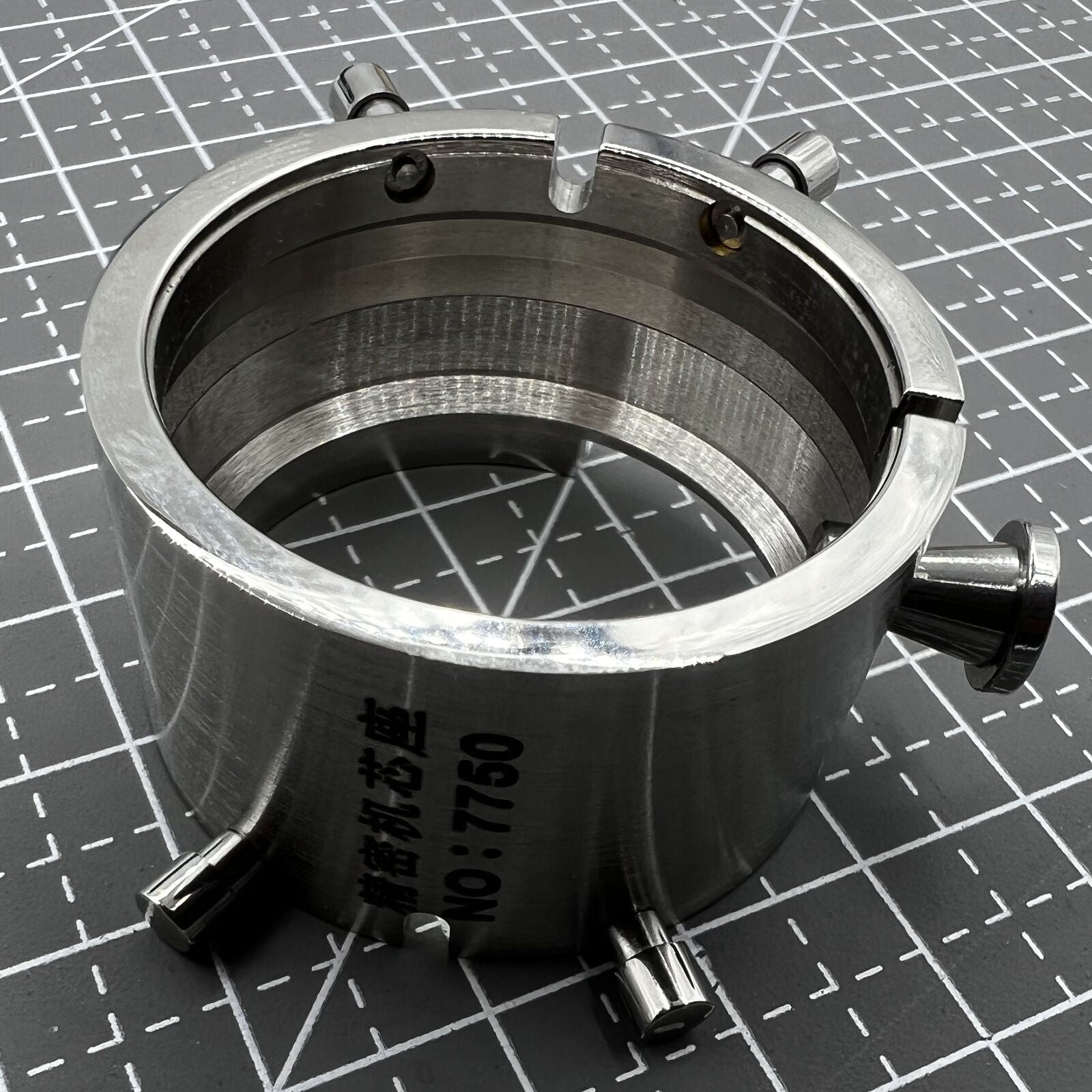 Chromium-plated ETA 7750 movement holder by Generic for secure watch repair and assembly.