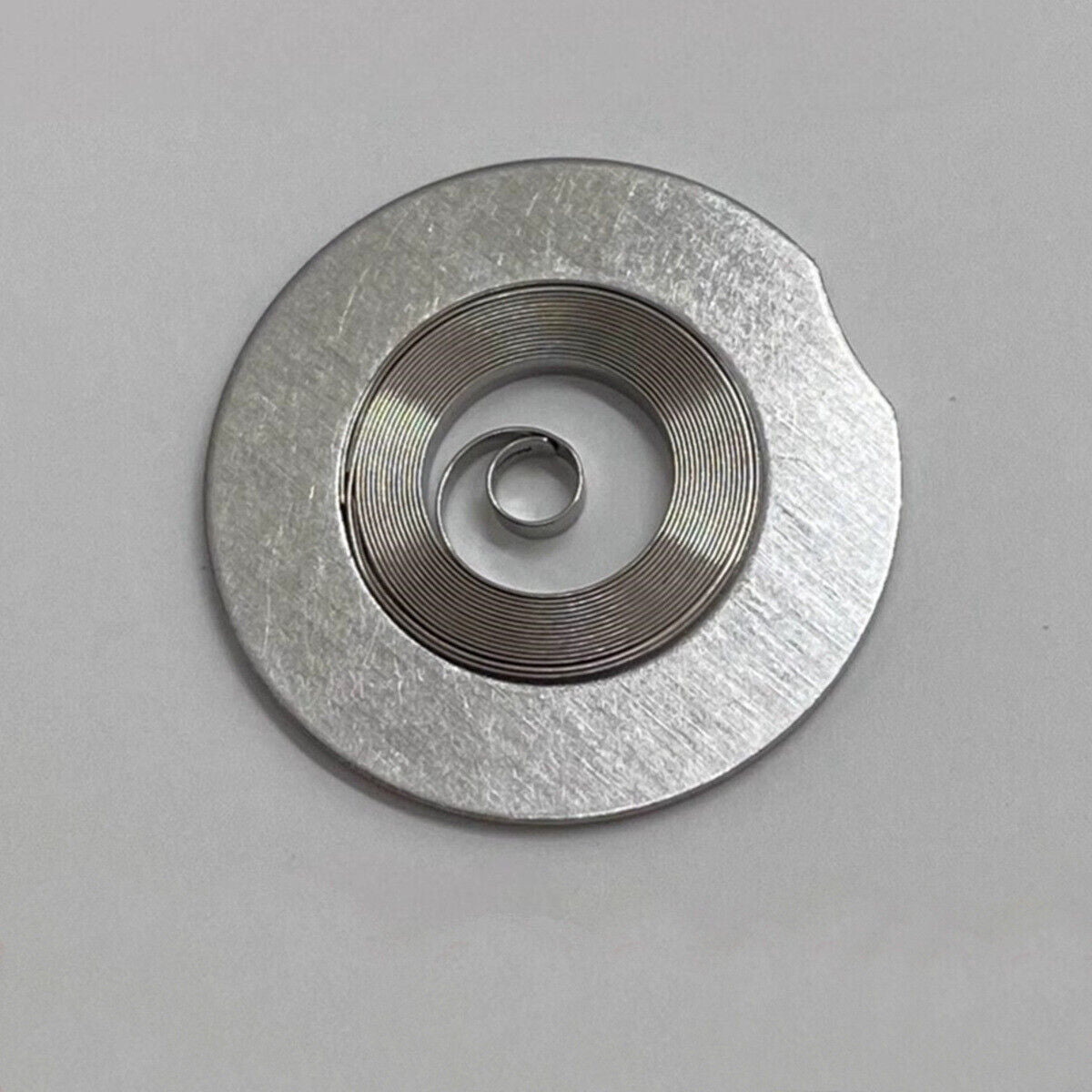 Complete mainspring for China Made ETA2824 2836 2834 watch movement, durable replacement part.