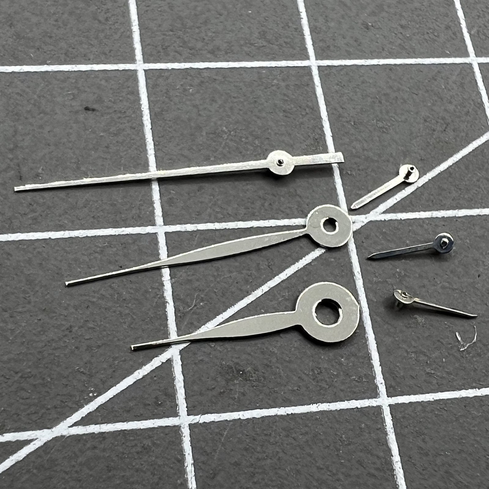14mm silver long arrow watch hands for Miyota 0S11 movement, sleek design, no lume.