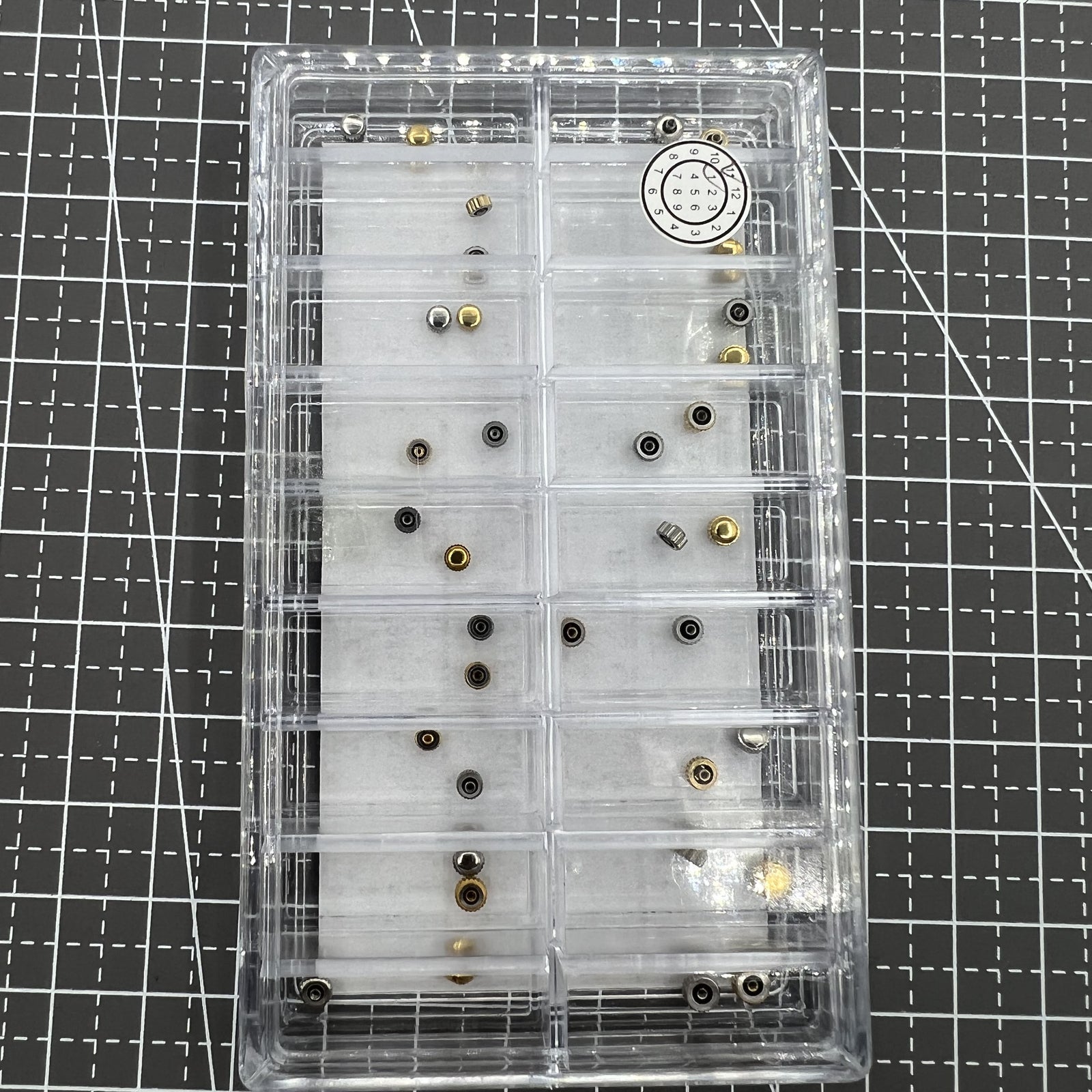 Set of 36 stainless steel watch crowns by Japan Style, ideal for precise watch repairs and replacements.