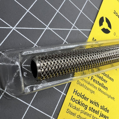 Bergeon 30432 pin vice with slide lock holding fine drills for precise watchmaking tasks.