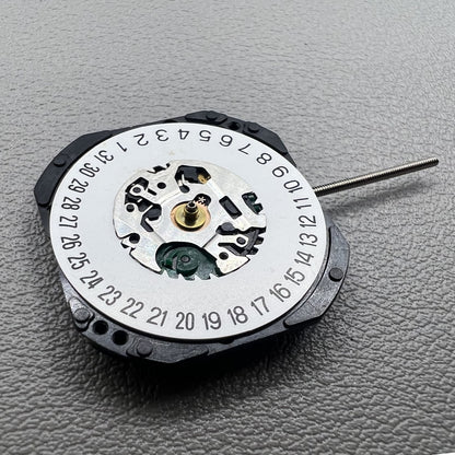 Japan V722C quartz watch movement displaying hour, minute, second hands, and date window at 6 o'clock ? reliable precision by Seiko.
