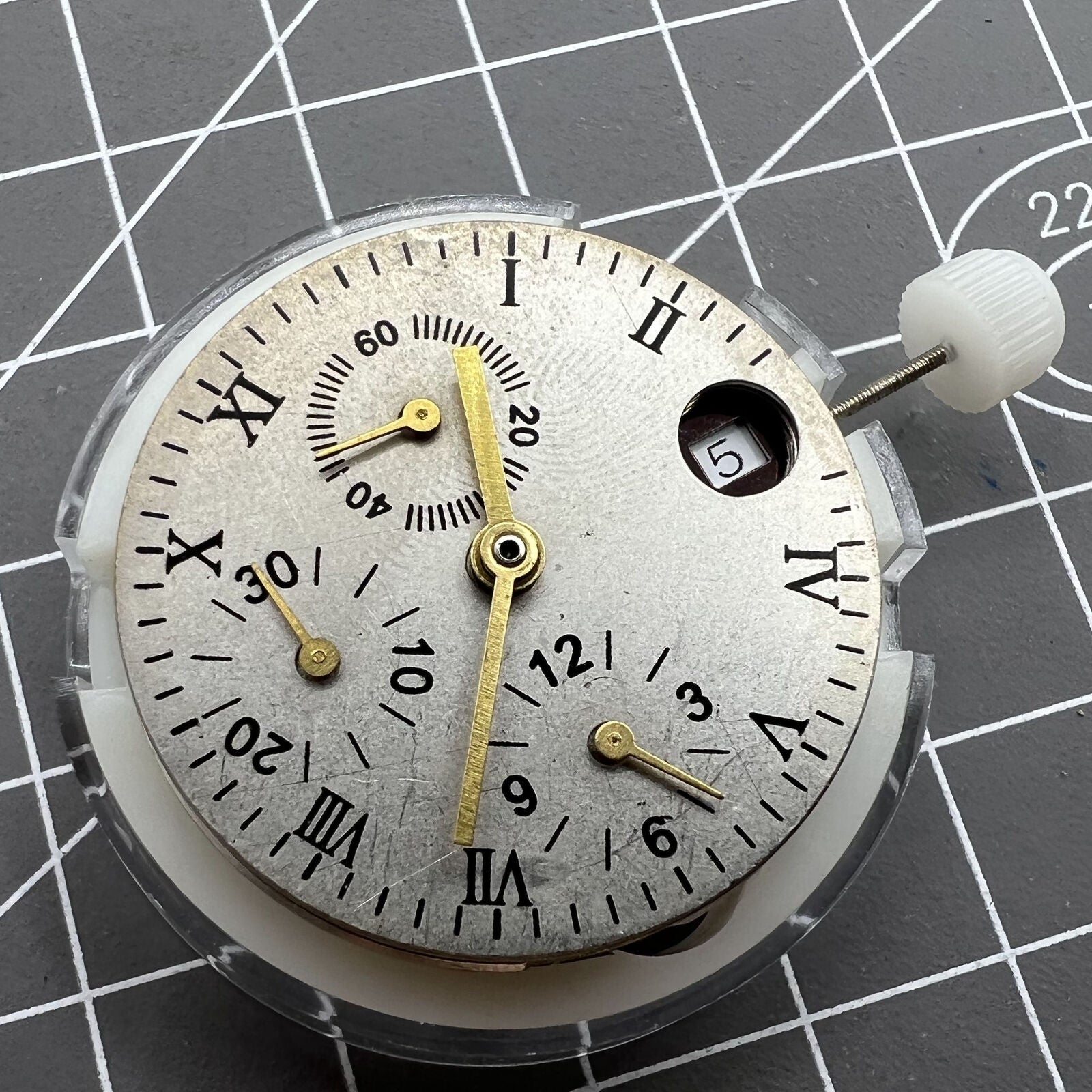 1. 7750 Automatic watch with mechanical movement and small second at 12, elegant design.  