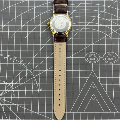 Beijing Double Rhomb mechanical watch with golden case and silver nail markers, elegant and classic style.