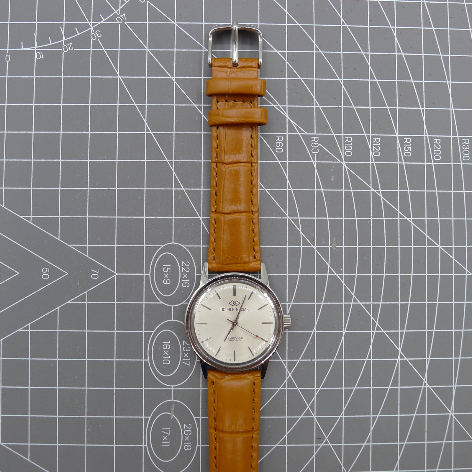 Beijing 36mm Double Rhomb watch with silver case, nail markers, and manual mechanical movement for precise timekeeping