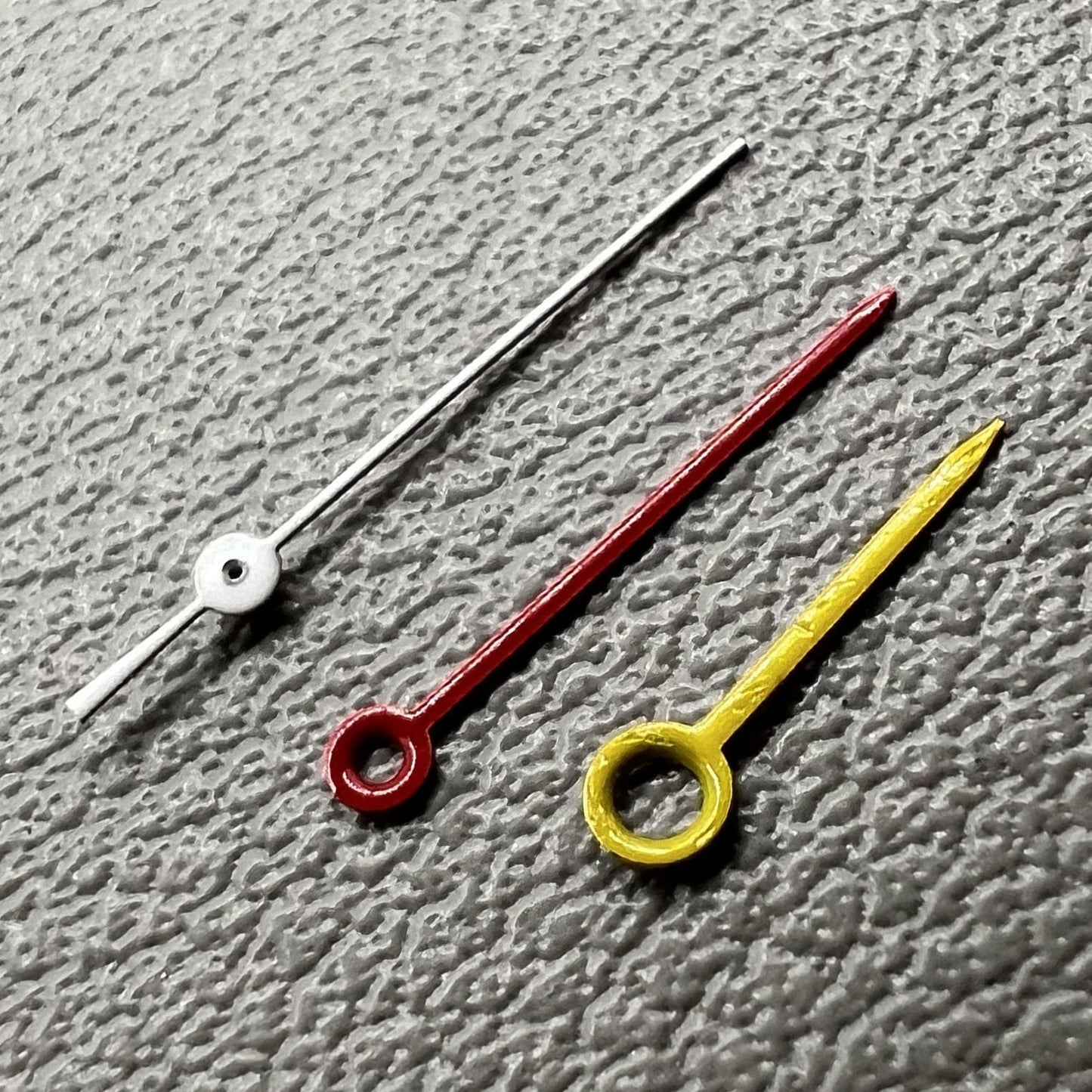 Yellow, red, and white watch hands set for Miyota 2035, 2115, 2105, 2305 movements.