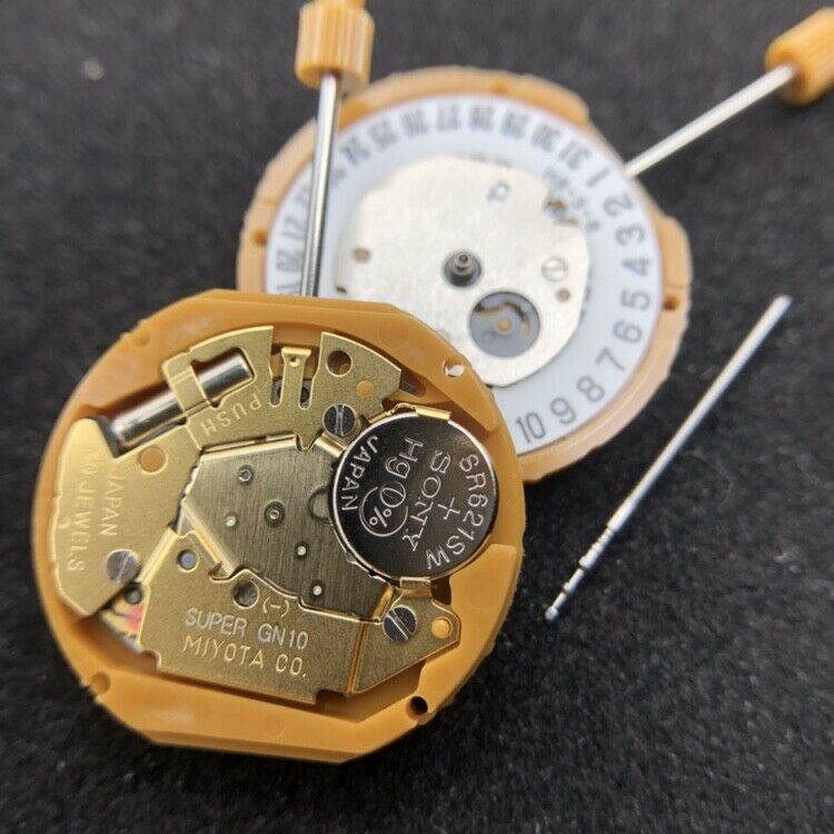 Miyota GN10 quartz watch movement featuring date displays at 3 and 6 o'clock positions for precise timekeeping.