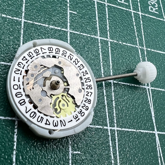 Sunon PE25 quartz watch movement with date at 3, 3 hands, ideal for replacement parts.