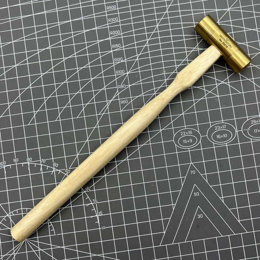 Swiss Made Bergeon 30416 brass hammer for precise watch accessory adjustments and repairs.
