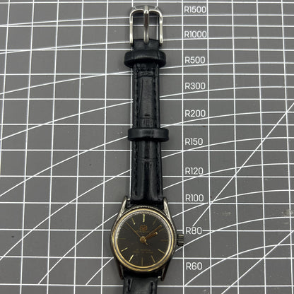 Seagull black case ladies manual mechanical watch with golden markers, shock-resistant for lasting durability.