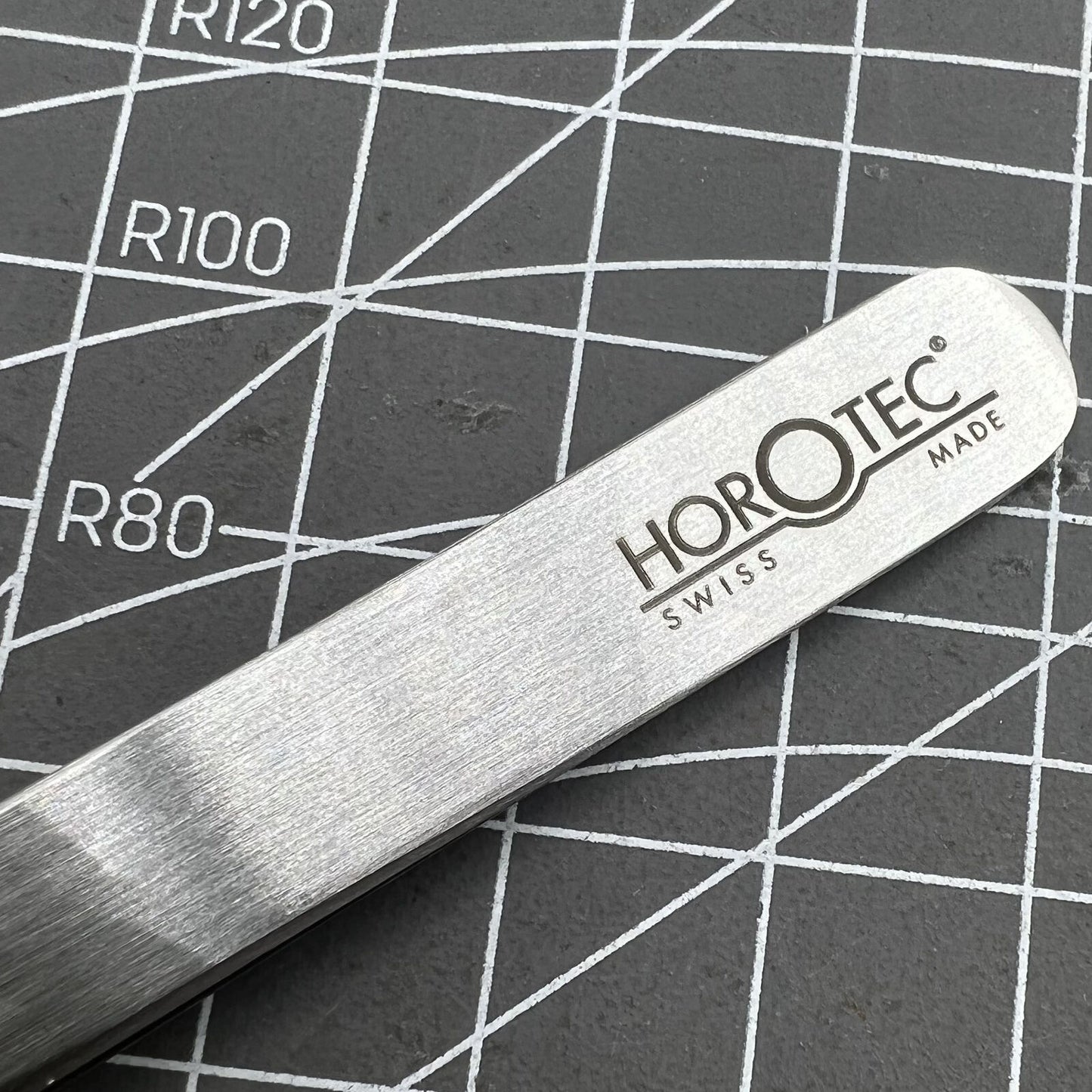 Swiss Horotec MSA12.302-3 antimagnetic fine tweezers for delicate hairspring handling in watch repairs.