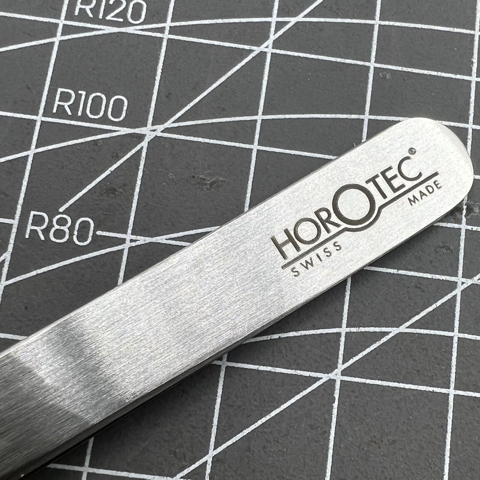 Swiss Horotec MSA12.302-3 antimagnetic fine tweezers for delicate hairspring handling in watch repairs.