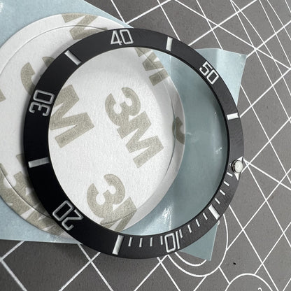 38mm ceramic watch bezel with black slope, silver font, and blue luminous details for watch accessories.