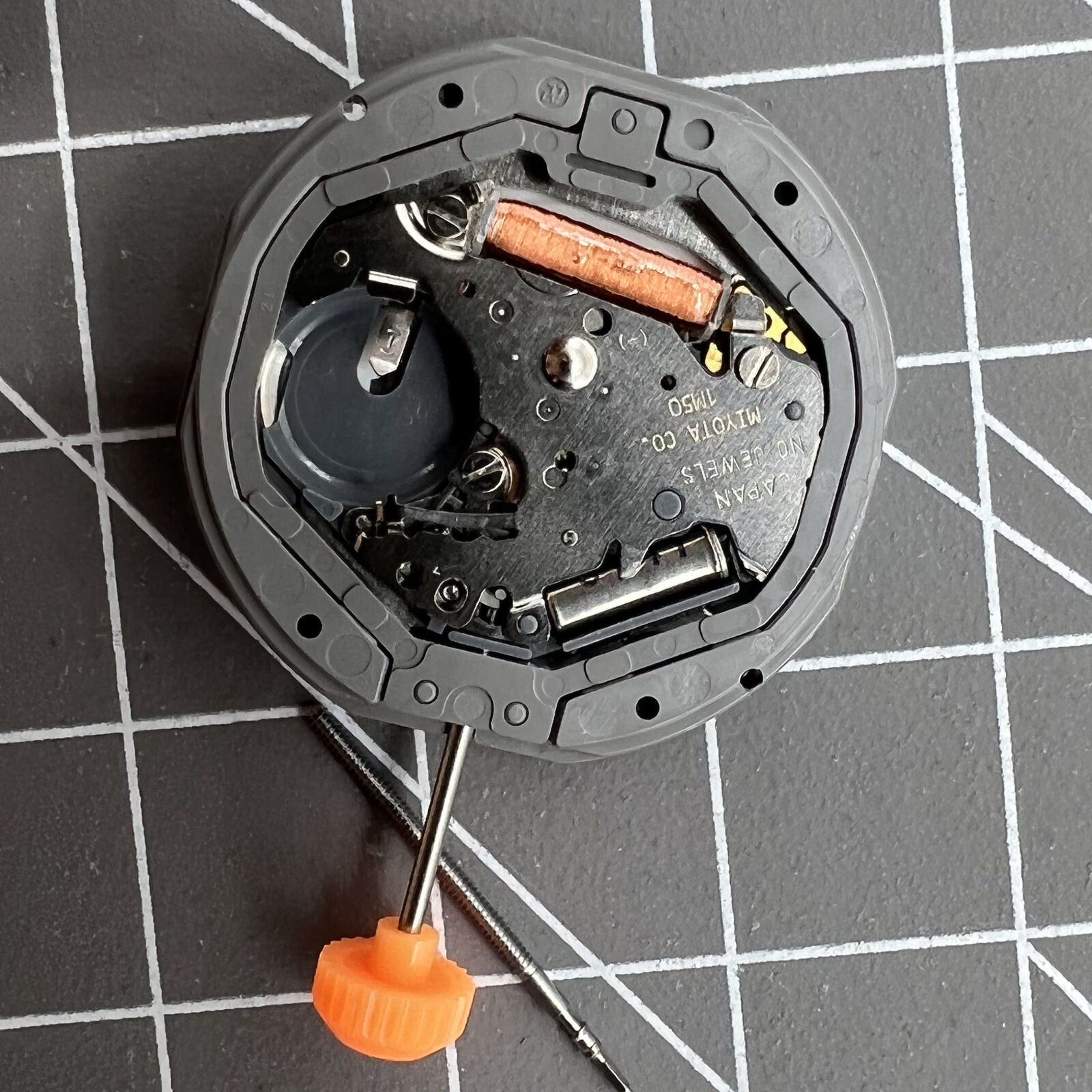Japan Made Miyota 1M50 quartz watch movement, precise and durable for quality watch repairs and accessories.