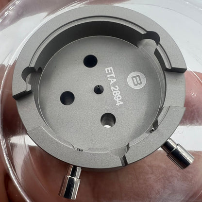Swiss Tool Bergeon 7100 movement holder for ETA 2894-2, precise watch repair accessory ensuring secure placement.