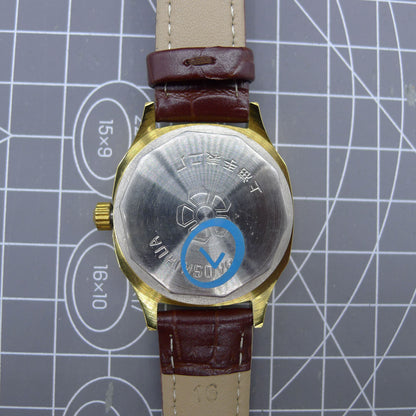 33mm Shanghai watch with blue dial, golden nail markers, square case, manual movement by Shanghai.