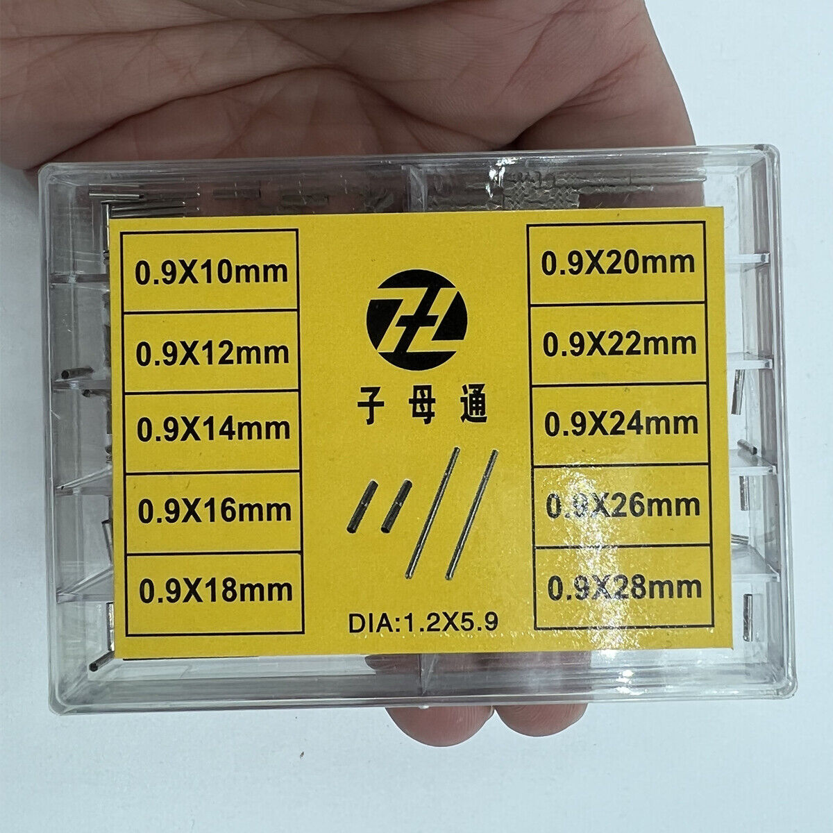 Stainless steel pins with tubes for watch bracelet adjustment, ideal for precise strap repairs.