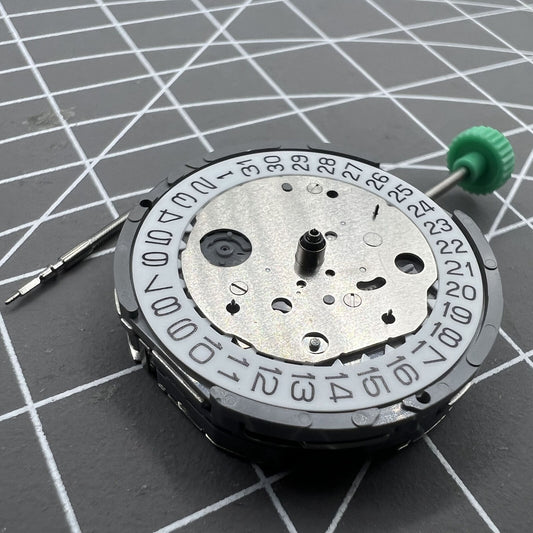 Miyota FS26 chronograph quartz watch movement with date at 4.5, precision Japanese craftsmanship.