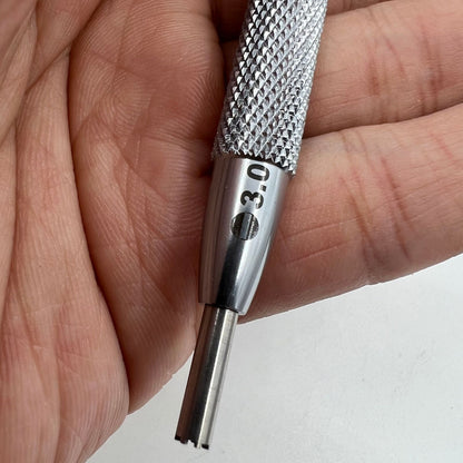 Omega 8800 watch movement tool with oscillating weight rotor screwdriver for precise watch repairs and maintenance.