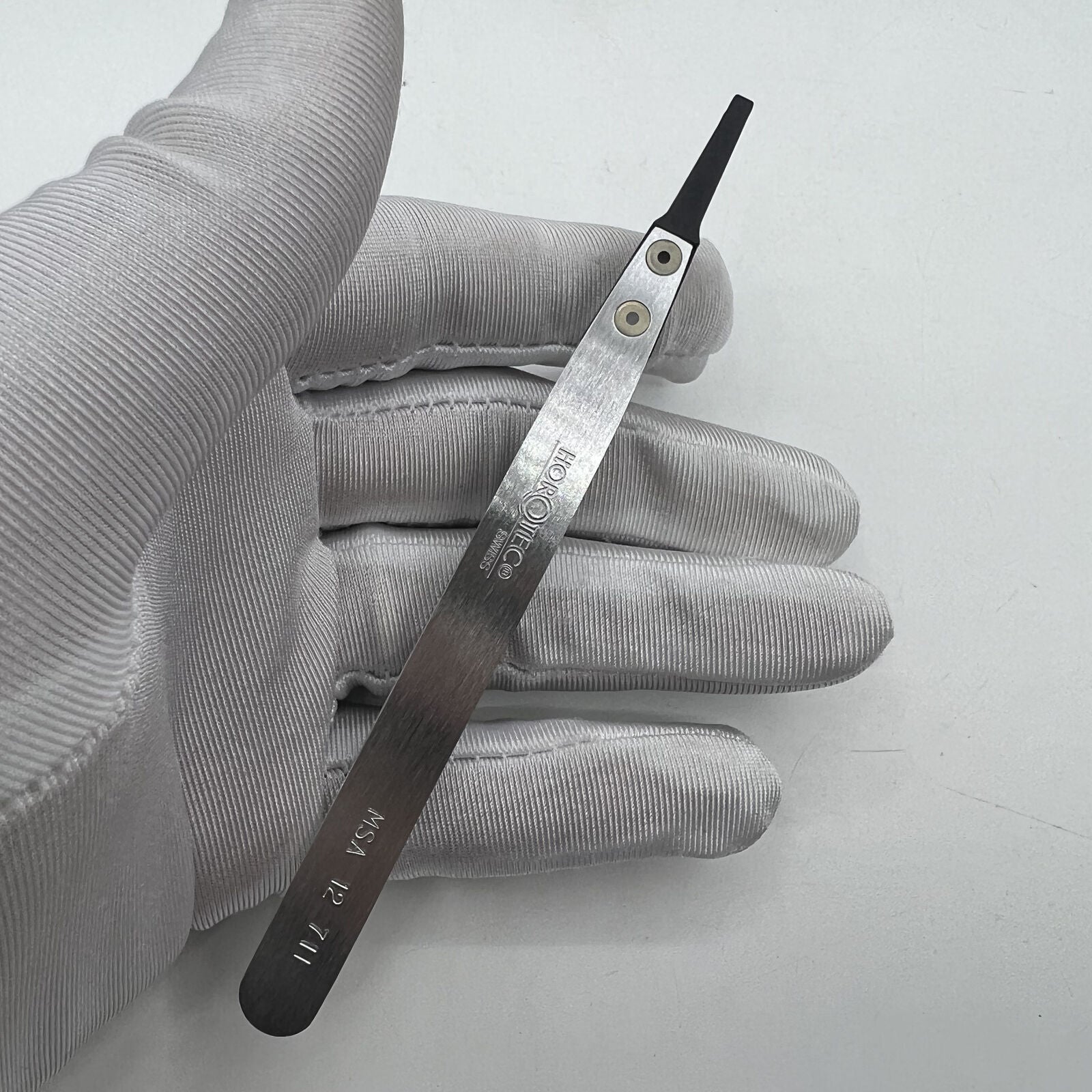 Swiss Made Horotec MSA12.711 carbon fibre tweezers with hard broad flat tips for precise watch accessory handling.