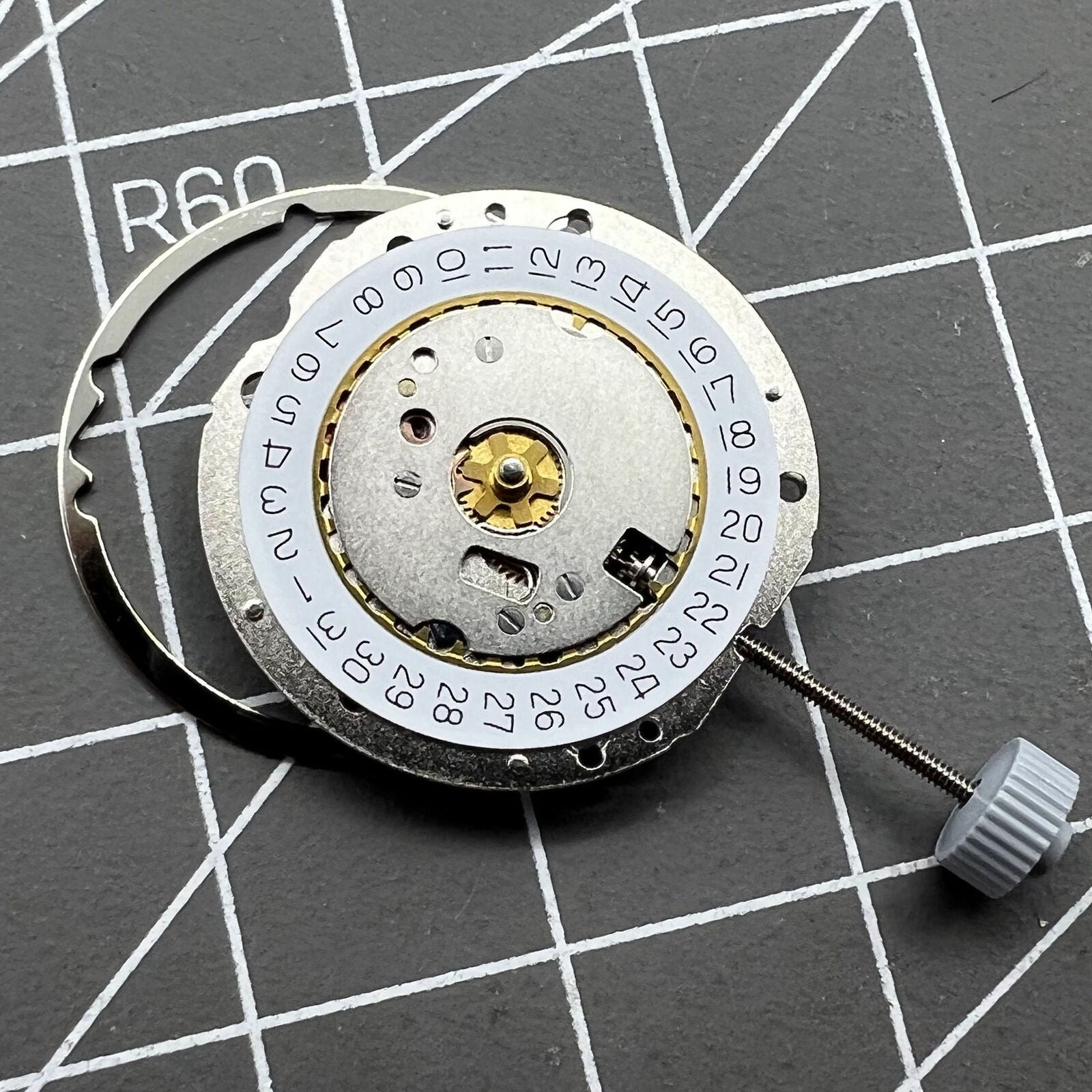Swiss Made Ronda 784 quartz watch movement with date display at 3 o'clock for precise timekeeping.