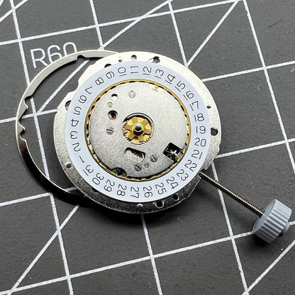 Swiss Made Ronda 784 quartz watch movement with date display at 3 o'clock for precise timekeeping.