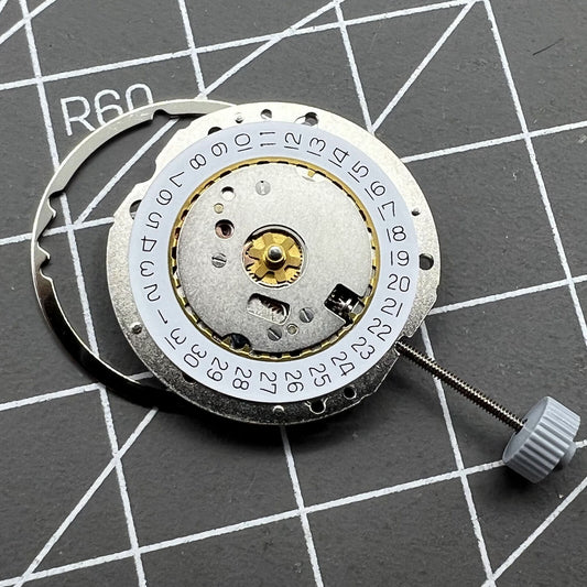 Swiss Made Ronda 784 quartz watch movement with date display at 3 o'clock for precise timekeeping.