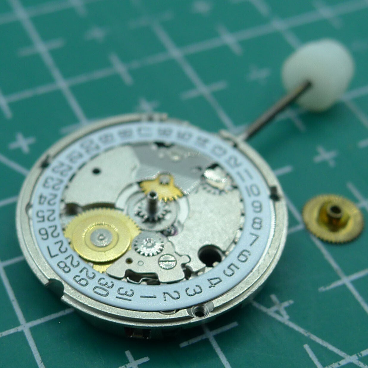Wholesale ETA 956.114 quartz movement with white dial and 3-hand display for watch repair and replacement.