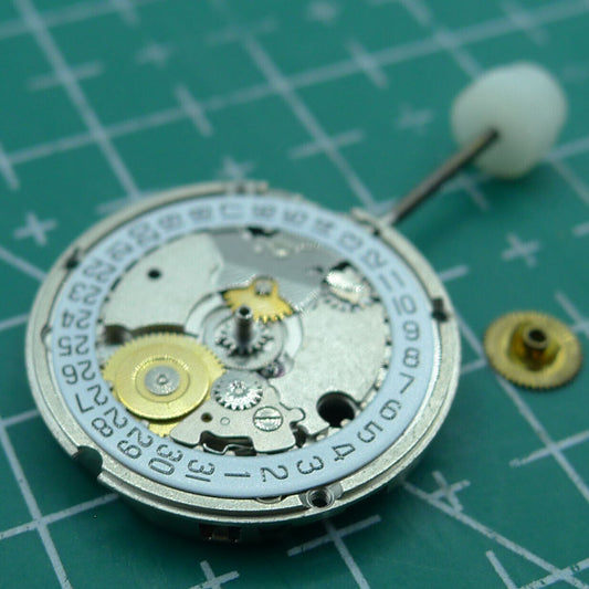Wholesale ETA 956.114 quartz movement with white dial and 3-hand display for watch repair and replacement.