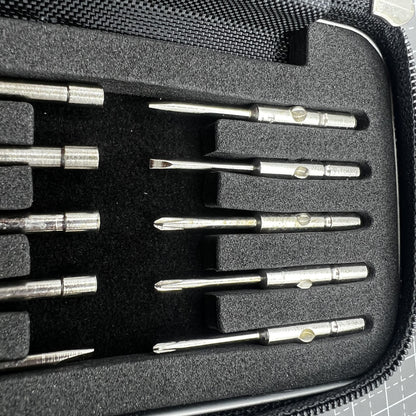 Precision screwdriver set with hex tools for watches and glasses repair, ergonomic grip.