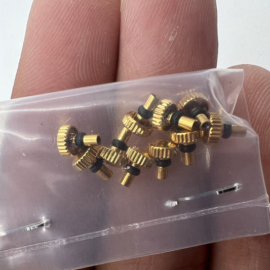 Golden watch crown for Orient watch movement, ideal for precise watch repairs and replacements.
