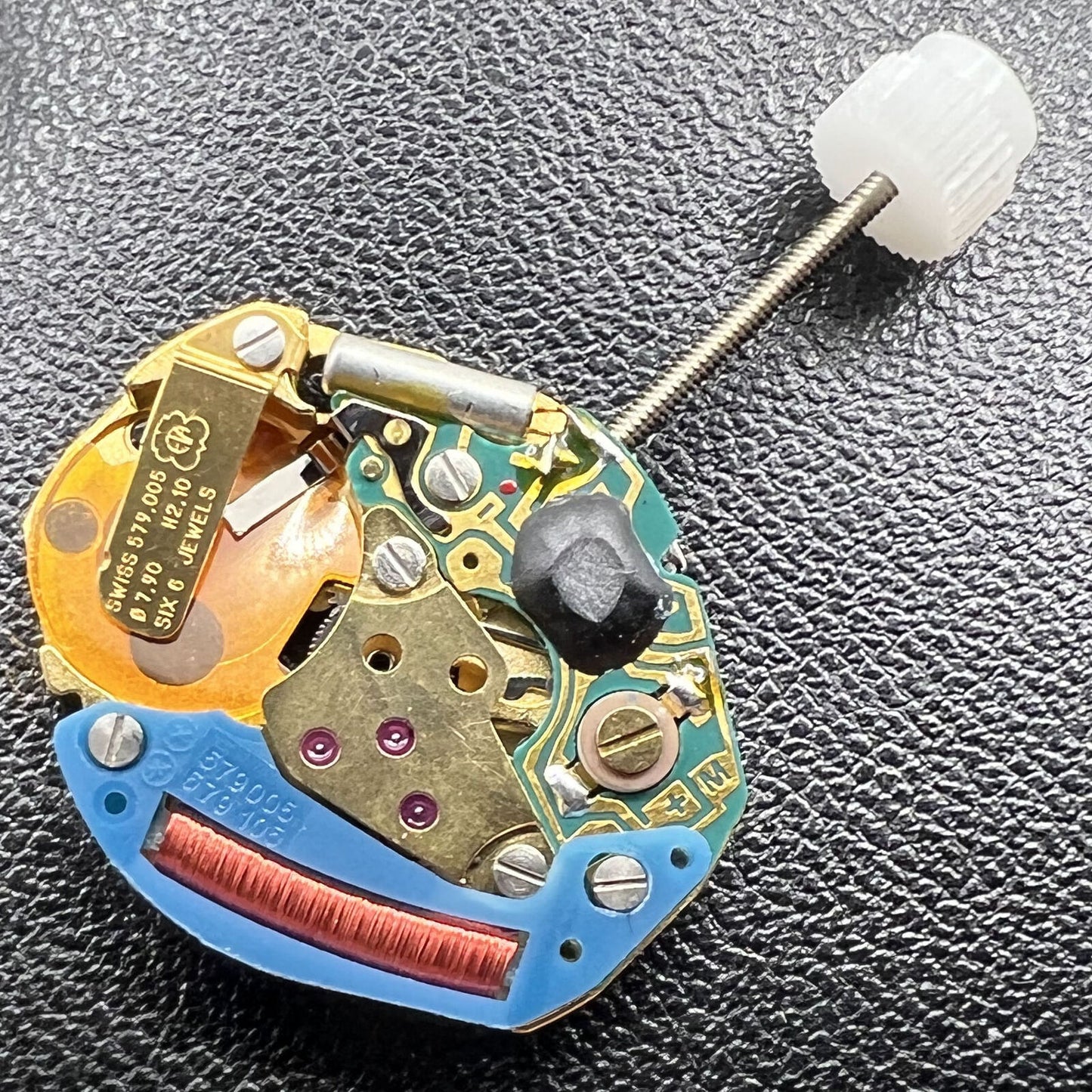 Swiss Made ETA579.005 quartz watch movement displaying hour and minute hands for accurate timekeeping in accessories.