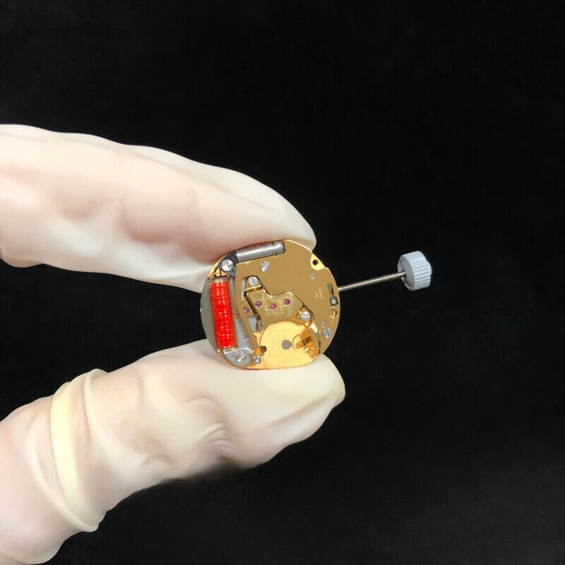 Original Swiss Made Ronda 773 quartz movement in gold gilted watch accessory for precise timekeeping.