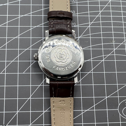 China Baihua 37mm manual mechanical watch with silver dial, 19 jewels, shock-resistant for durable wear.