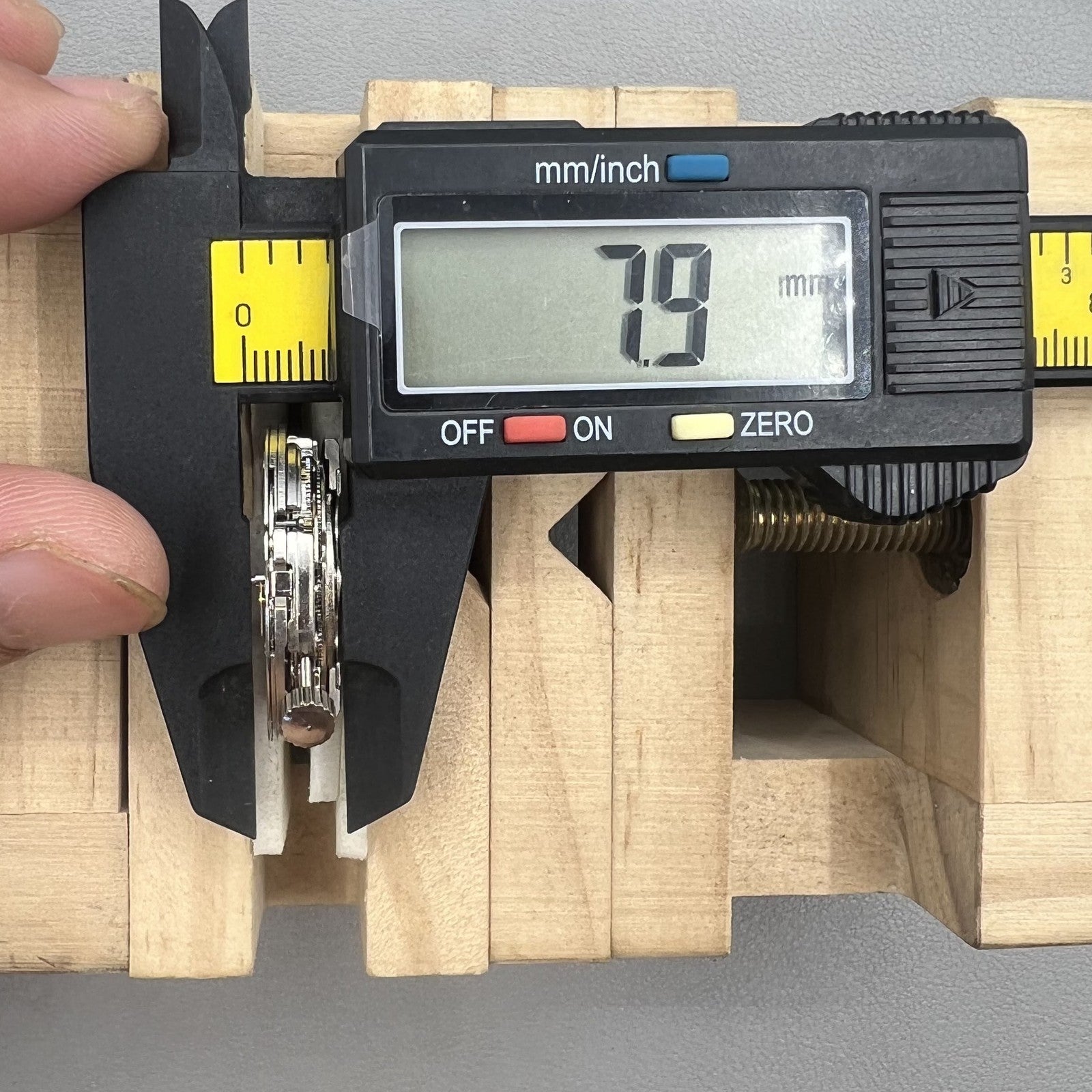 Tianjin ST17 T17 hand-wound watch movement with two hands and power reserve indicator at 10 o'clock.