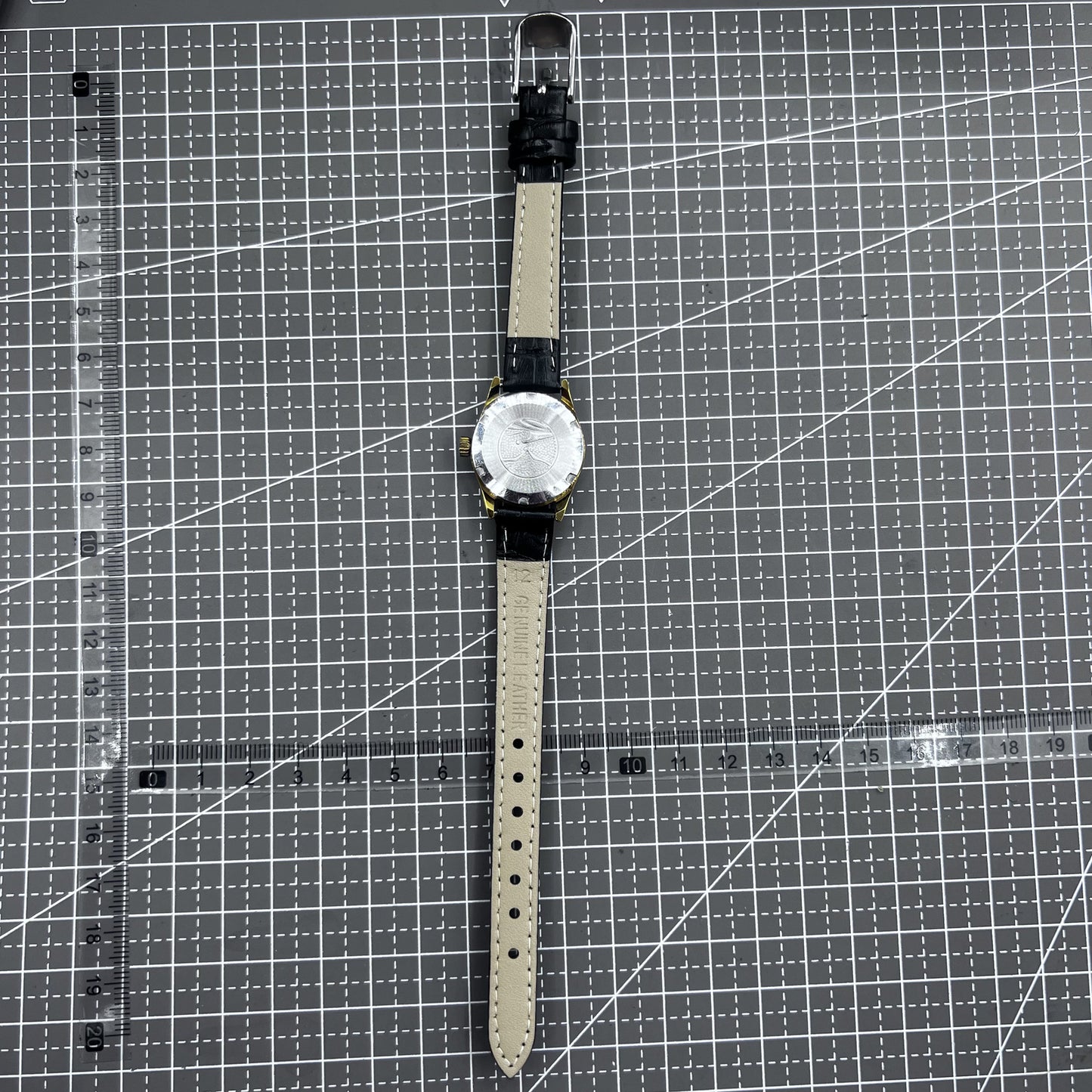 Black round case ladies watch with golden markers, Tianjin Seagull manual mechanical movement, elegant style.