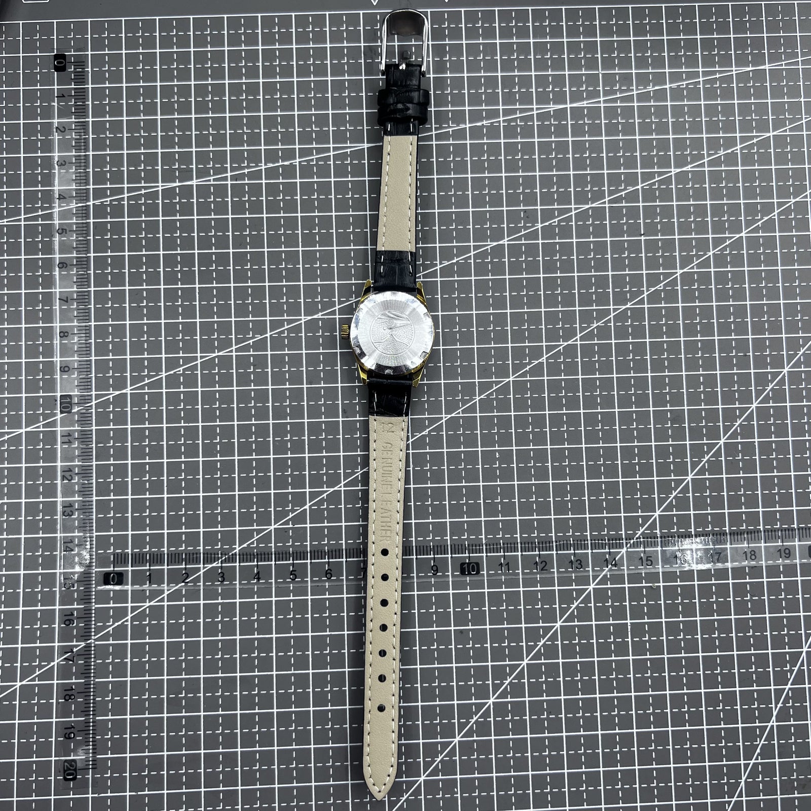 Black round case ladies watch with golden markers, Tianjin Seagull manual mechanical movement, elegant style.