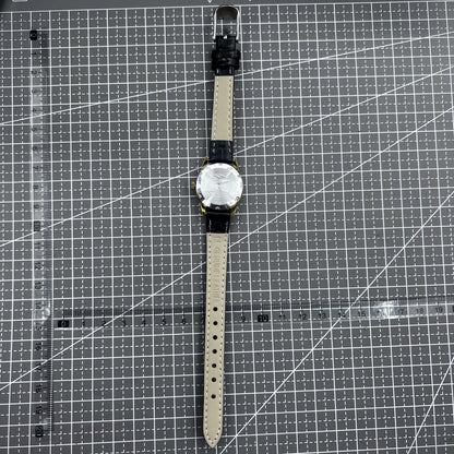 Black round case ladies watch with golden markers, Tianjin Seagull manual mechanical movement, elegant style.