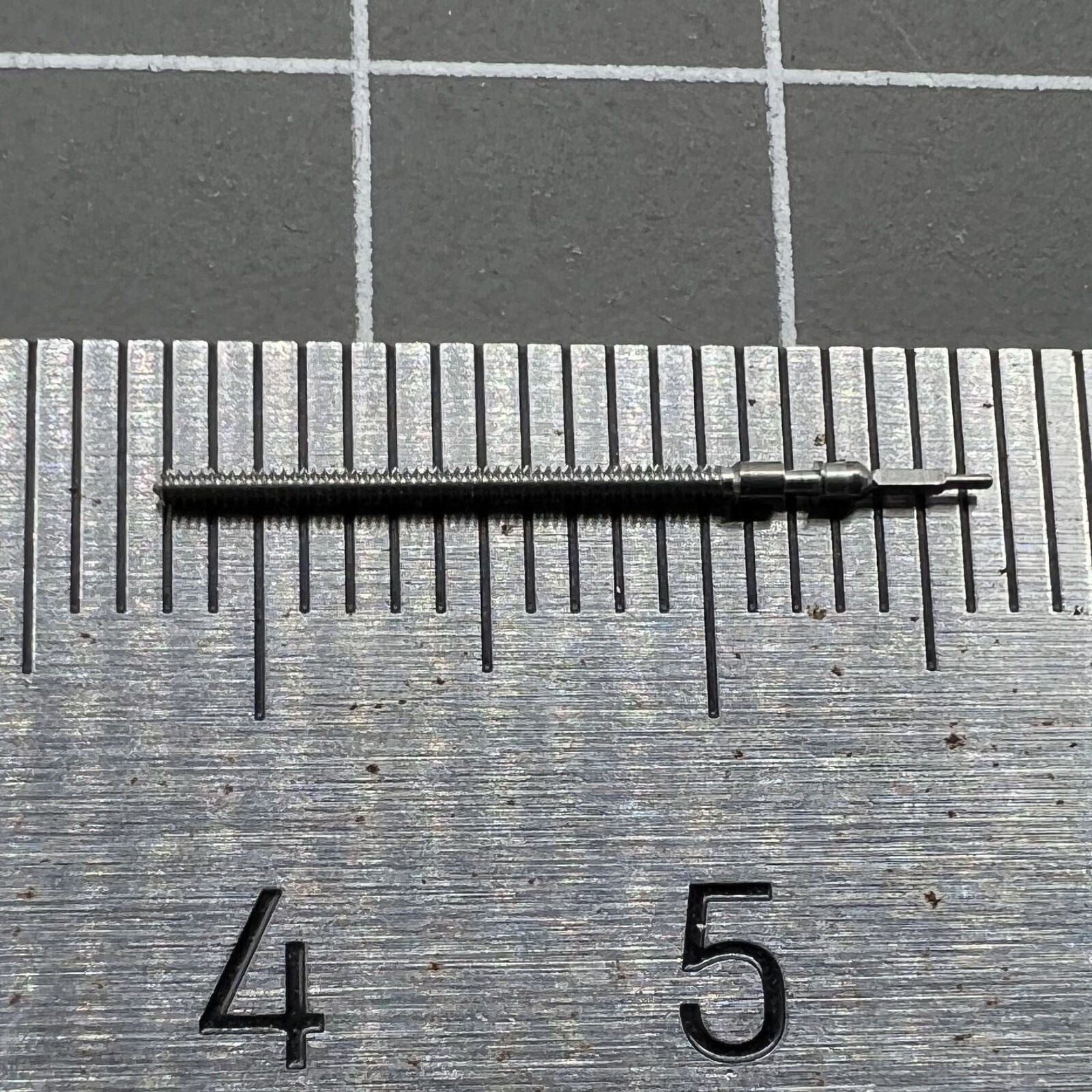 Precision watch winding stem compatible with Miyota 2115 and 2105 movements for reliable repairs.