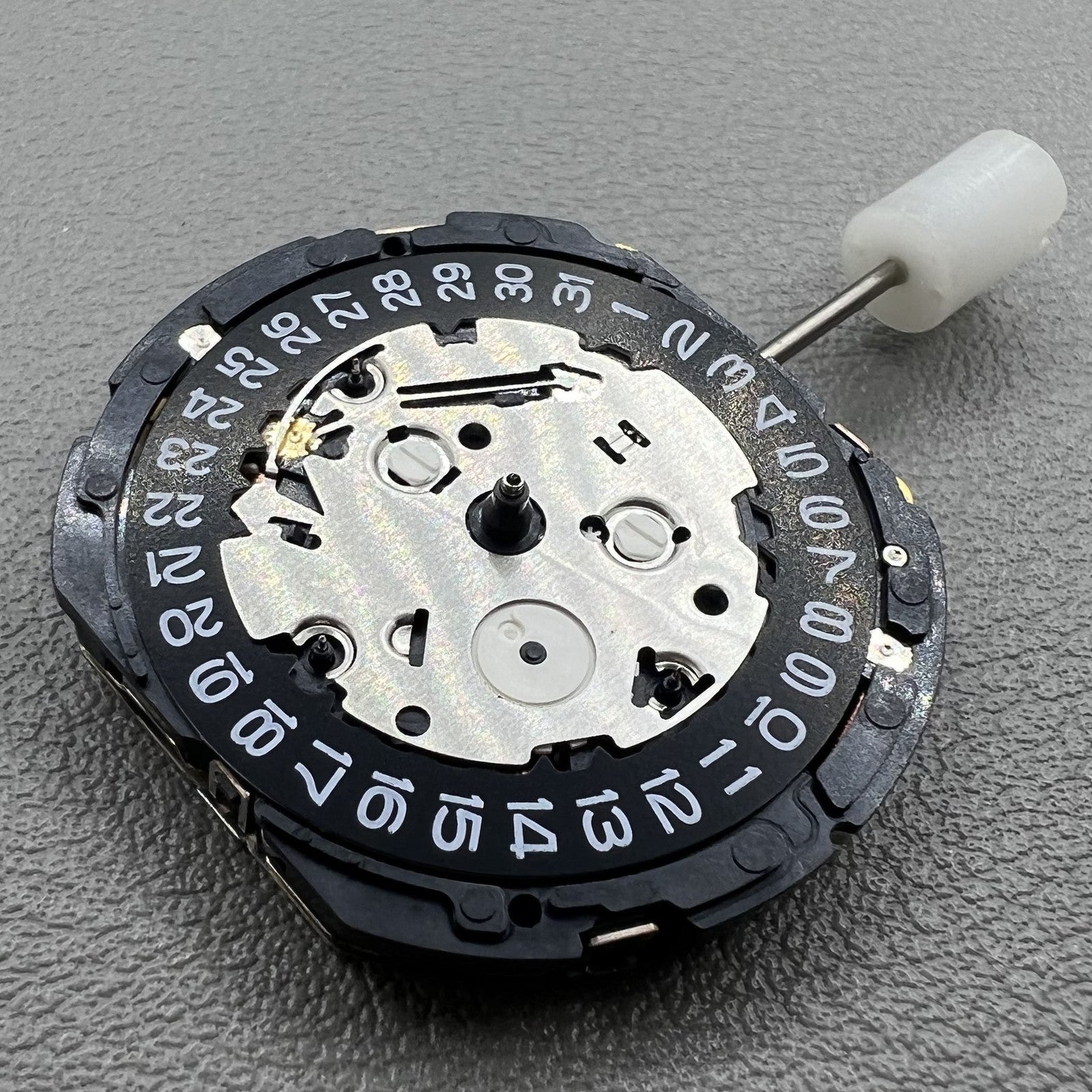 Seiko 7T85A quartz watch movement from Japan, precise and reliable mechanism for watches.