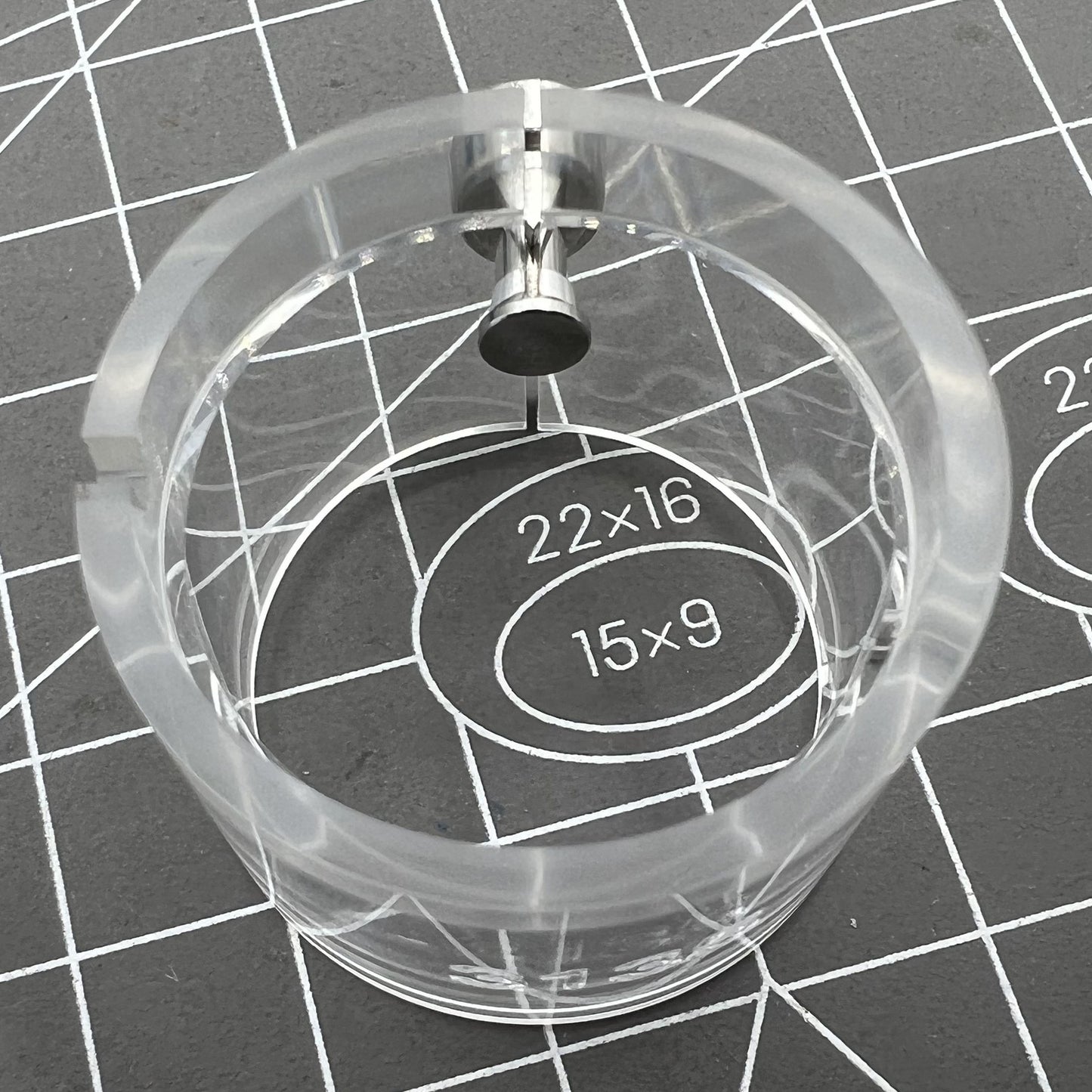 Transparent watch movement holder for RLX3135, secure and precise accessory.