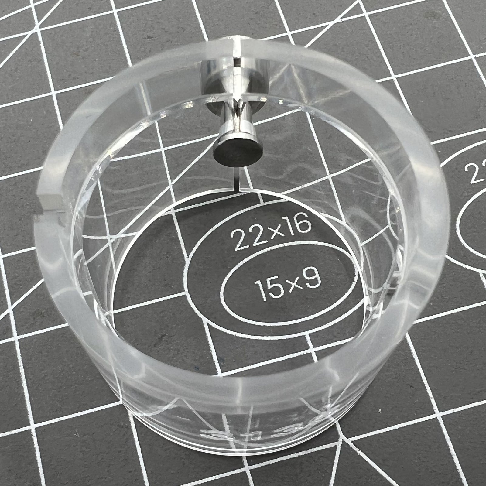 Transparent watch movement holder for RLX3135, secure and precise accessory.
